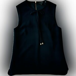 Black sleeveless blouse with bow